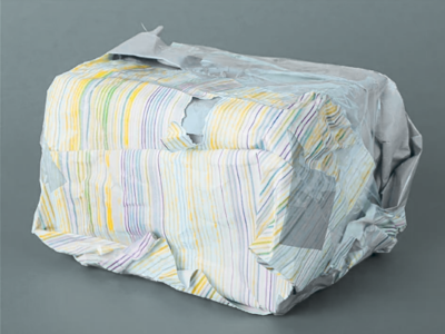 grayish background and a poorly wrapped gift